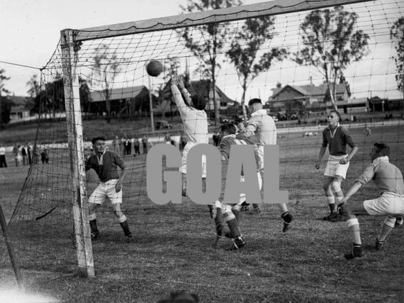800px-StateLibQld_1_194039_Shot_for_goal_during_a_soccer_match_in_Brisbane,_ca._1937
